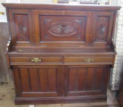 An Edwardian mahogany desk, fitted with a fall flap with writing surface, reveling pigeon holes