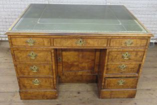 An Antique elm writing desk, with tooled leather top and drop flap, fitted to the front, with one