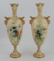 A pair of Royal Worcester blushed ivory vase, decorated with thistles and having masked handles,