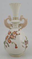 A Royal Worcester vase, decorated with flowers, with stylized dolphin handles, shape No 1327, height