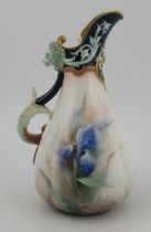 A Hadley Worcester quarter lobbed jug, decorated with irises, with a swirling handle and lion masks,