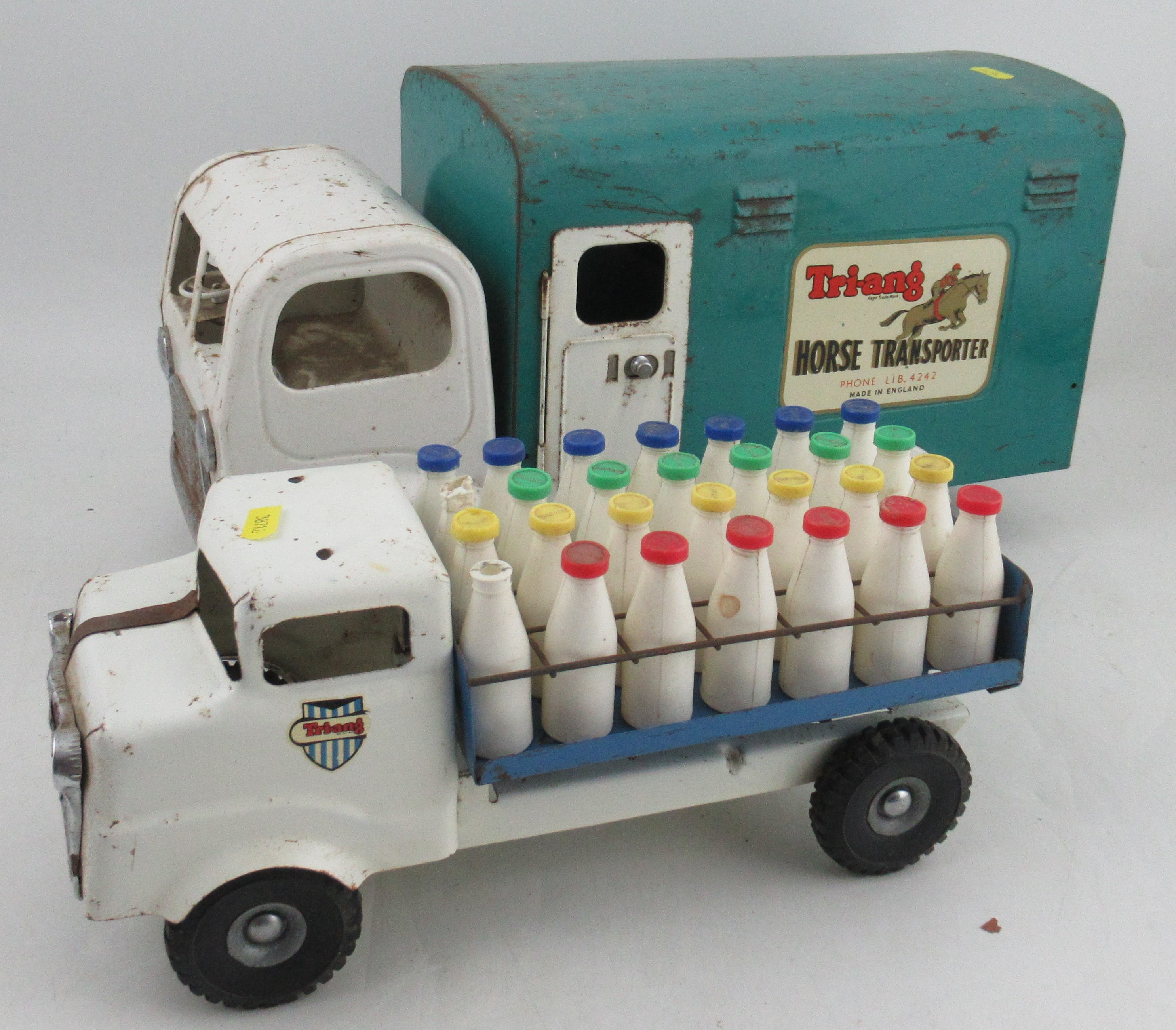 A Tri-ang Horse Transporter, together with a Tri-ang milk float with milk bottles