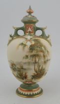 A Royal Worcester globular covered vase, decorated with a landscape and water enhanced with gilt,