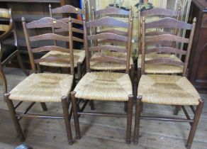 A set of 6 ladder back dining chairs, with wicker seats