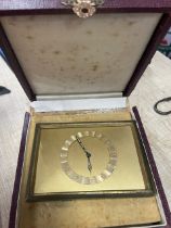 A gilt metal Art Deco style travelling clock, of rectangular form, with easel support, 2.5ins x