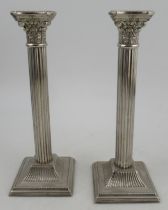 A pair of silver plated Corinthian column candlesticks, height 10.5ins Condition Report: