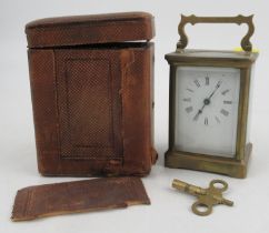 A carriage clock, engraved R&Co Made in Paris, with travel case