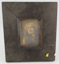 A 19th century photograph, of a woman in pre-Raphaelite style dress, in a pine frame