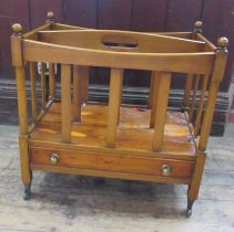 A reproduction yew wood Canterbury, fitted with a drawer