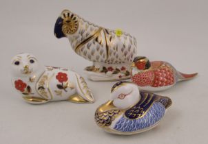 Four Royal Crown Derby paperweights, a seal, ram, duck and a pheasant