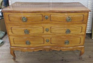 An Antique double fronted serpentine continental commode chest, of three drawers, raised on short