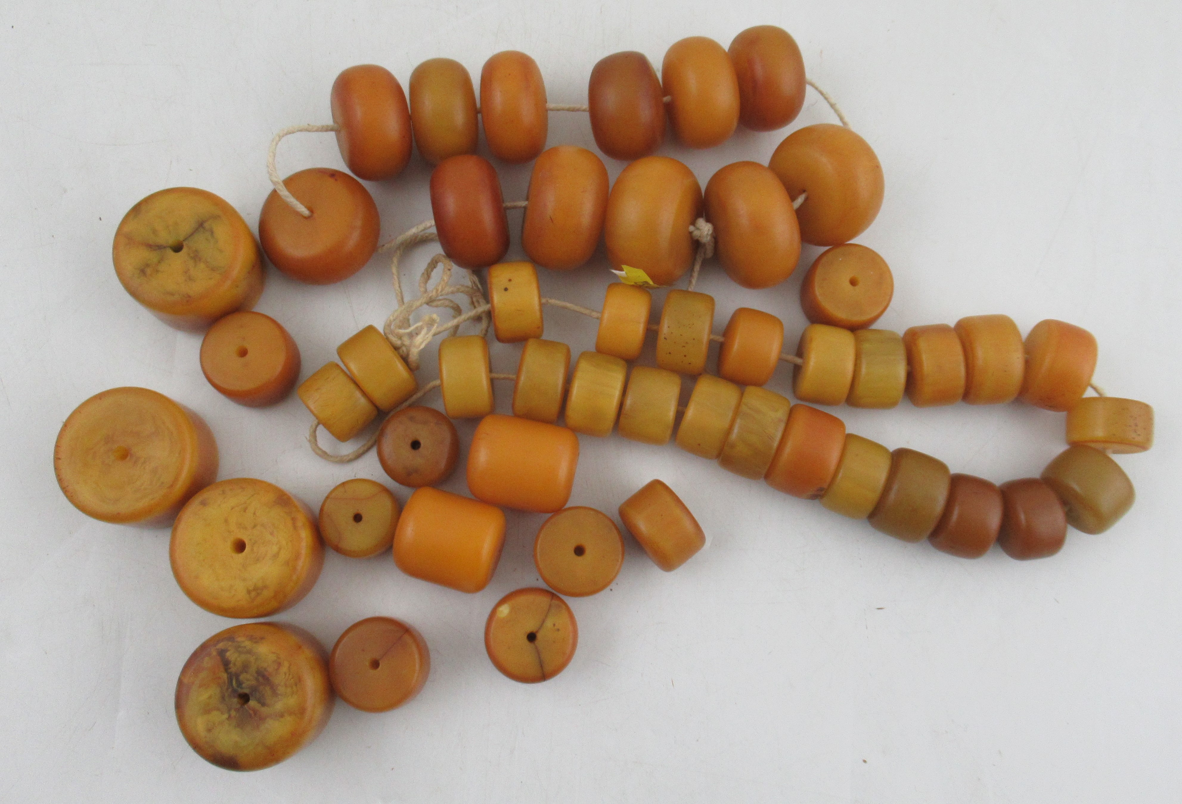 A collection of assorted amber type beads