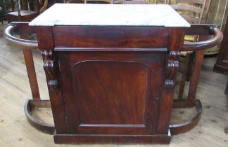 A marble topped mahogany hall cabinet, fitted with a drawer over a cupboard, flanked by stick stands