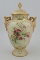 A Royal Worcester blushed ivory vase, with associated cover, decorated with flowers, with masked