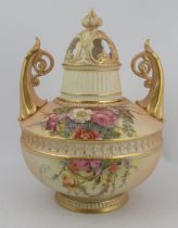 A Royal Worcester blushed ivory two handled vase, decorated with flowers, signed W. Hale  with
