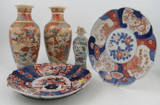 A collection of Oriental porcelain, to include a pair of vases, two circular dishes and a covered