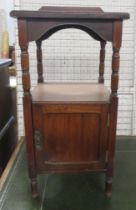 An Edwardian oak bedside cabinet