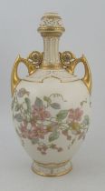 A Royal Worcester gilded ivory vase, decorated with foliage with gilt handles and pierced neck,