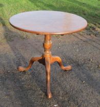 A circular mahogany occasional table, raised on tripod base, width 27ins