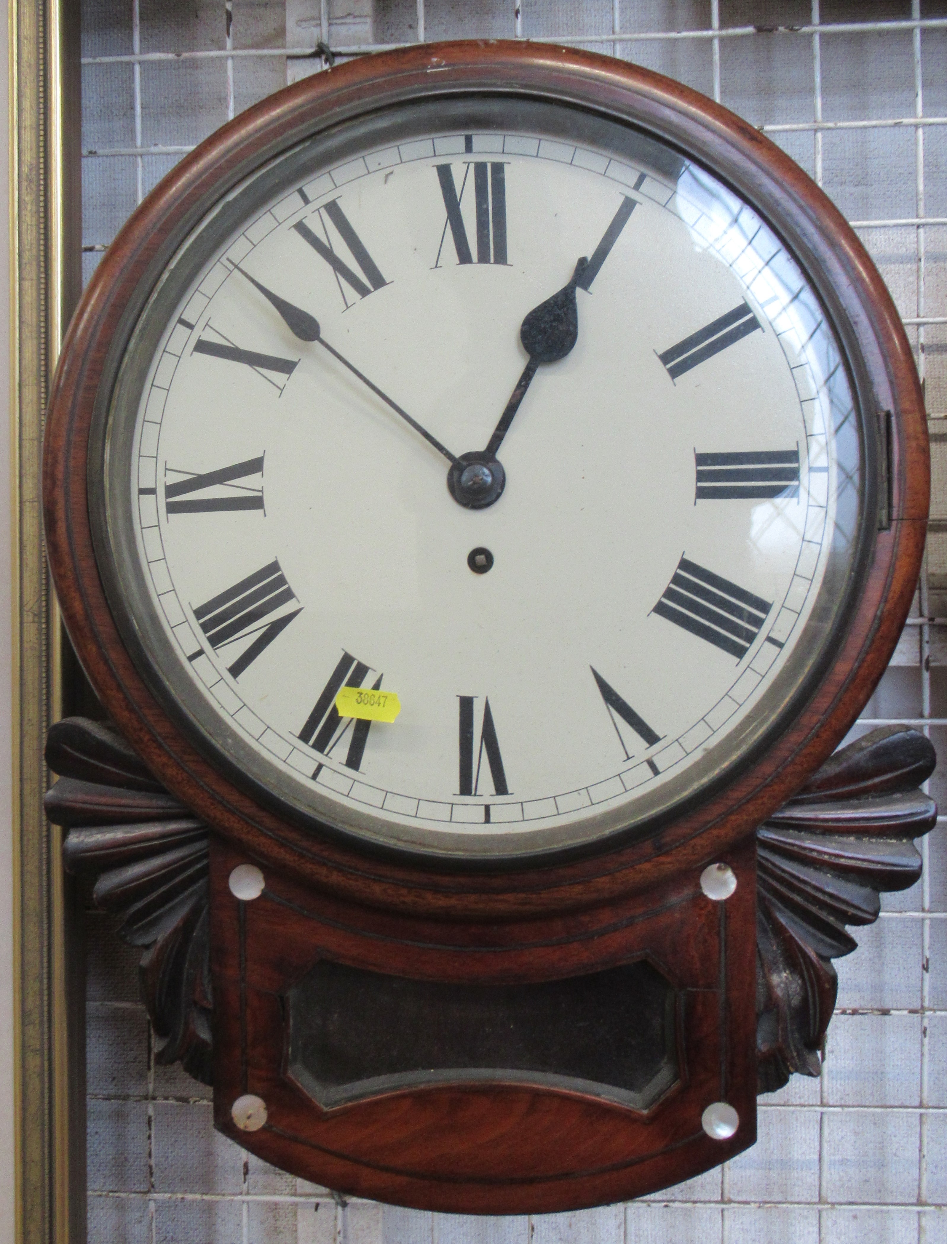 A 19th century mahogany drop dial wall clock, with mother of pearl inlay and carved decoration,