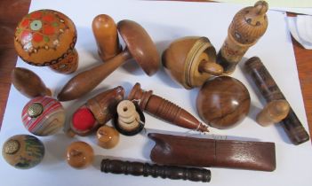 A collection of wooden sewing related items, to include darning mushrooms, bobbin cases etc