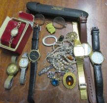 A collection of costume jewellery and wrist watches