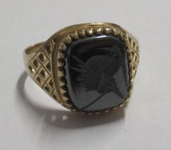 A gold signet ring, set with a carved stone, marked .975, weight 3.7g