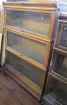 A Globe-Wernicke style three section bookcase, with glazed hinged fronts, 34ins x 12ins, height