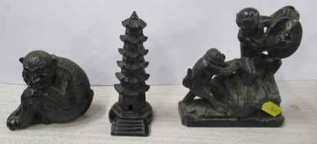 Three black mineral models, two of monkeys and one of an Eastern temple, height 3.5ins and 5ins