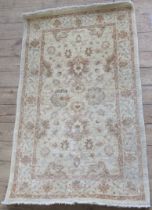 A modern beige ground rug, 58ins x 36.5ins (34648)