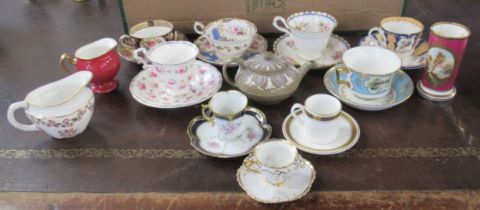 A collection of cups and saucers, together with a Wedgwood tea pot, spill vase etc