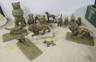 A collection of brass models, to include dogs, a bear and lions