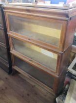 A Globe-Wernicke style three section bookcase, with glazed hinged fronts, 34ins x 12ins, height