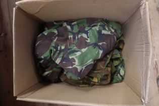 A box of military uniforms and fatigues