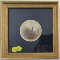 A circular Royal Worcester plaque, decorated with a cock pheasant by James Stinton, diameter 1.75ins