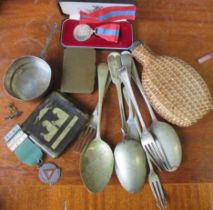 A collection of items, to include flatware, a wicker covered flask, a Stratton compact, a small