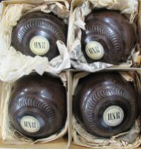 A set of four Crescent lawn green bowling balls, together with another set  7RJ5YWUT