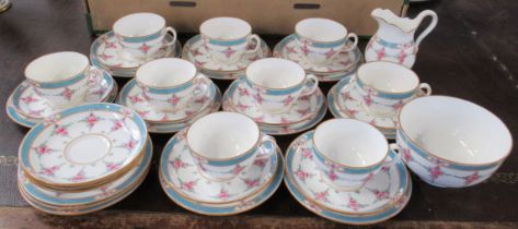 A Minton tea set, comprising 9 cups, 12 saucers, 12 side plates, a jug and a sugar bowl, together