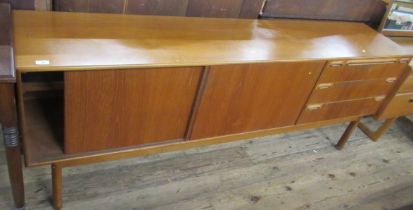 A 20th century McIntosh sideboard, fitted with sliding doors and drawers, 79ins x 16ins, height
