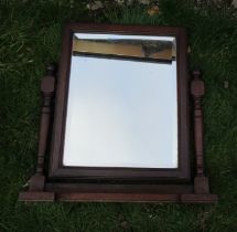 A dressing table mirror and another