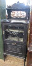 An ebonized Edwardian Music cabinet, height 60ins, width 24ins, depth 14ins