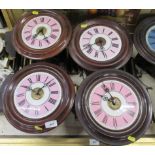 Four late 19th/ early 20th  century postage alarm clocks, with pink and white enamel dials