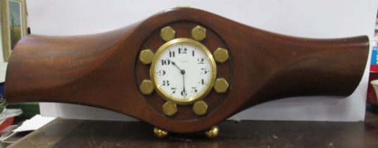 A mahogany propeller clock, the movement marked Buren, the dial Wilson & Gill