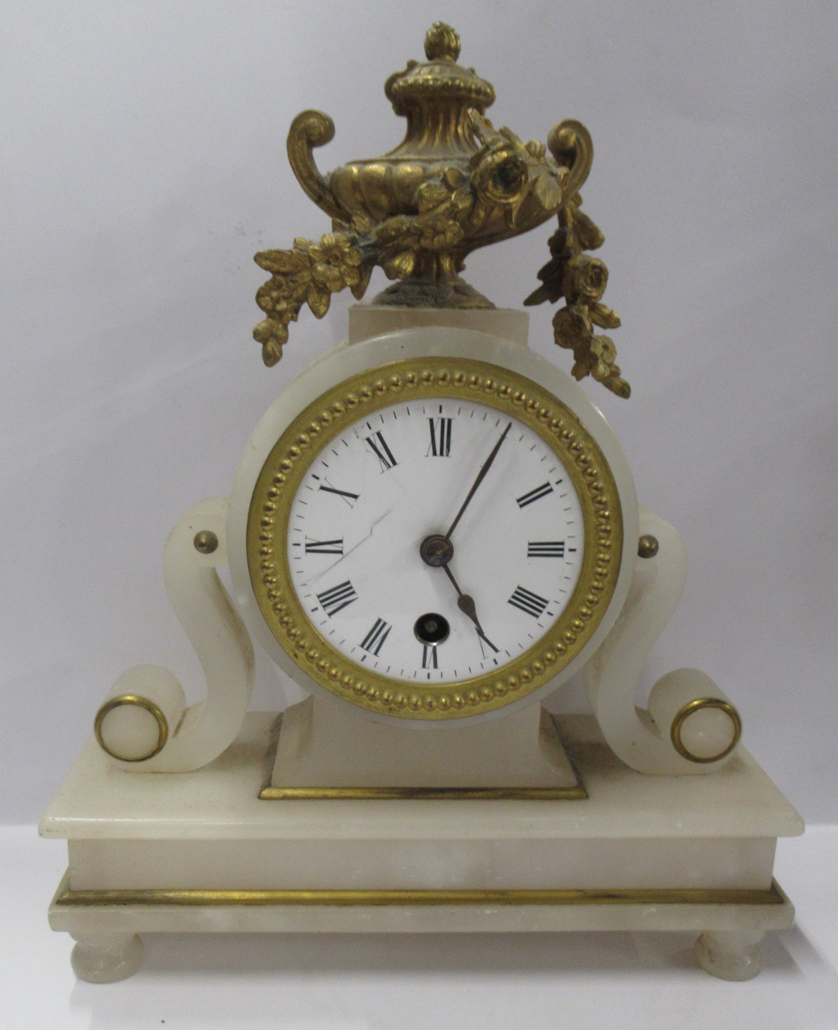 A 19th century marble cased mantel clock, with gilt metal urn and swag decoration, height 10.5ins