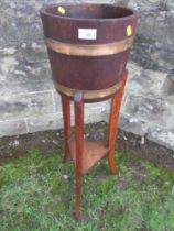 An oak jardinière stand, height 36ins