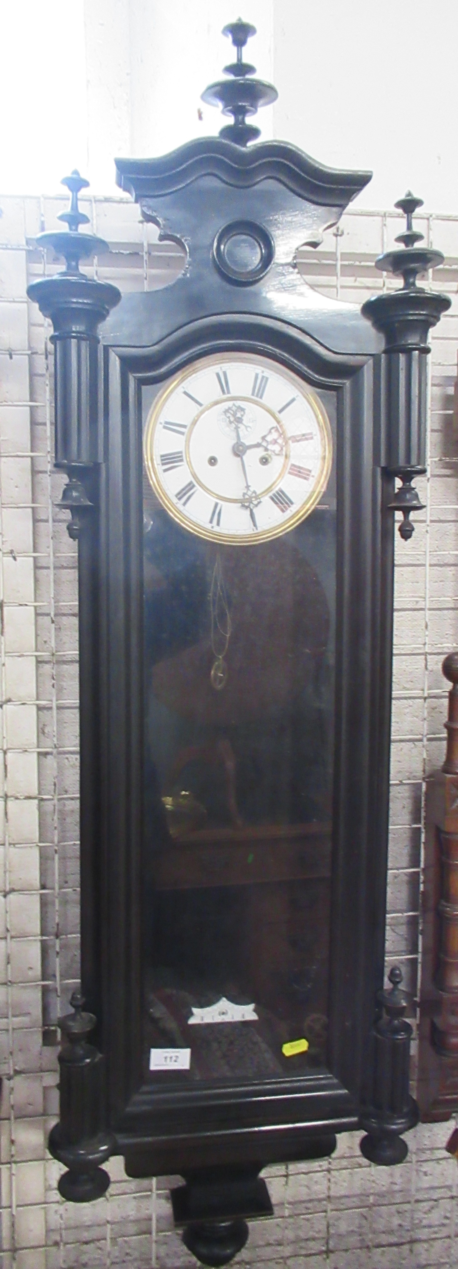 A Vienna style wall clock, with ebonised case, height 50ins