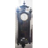 A Vienna style wall clock, with ebonised case, height 50ins