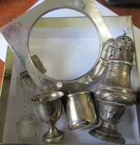 A silver sugar caster, together with an egg cup and cup, weight 4oz, together with a silver