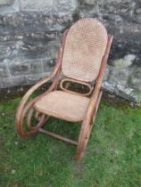 A Brentwood Rocking Chair with cane seat and a cane back