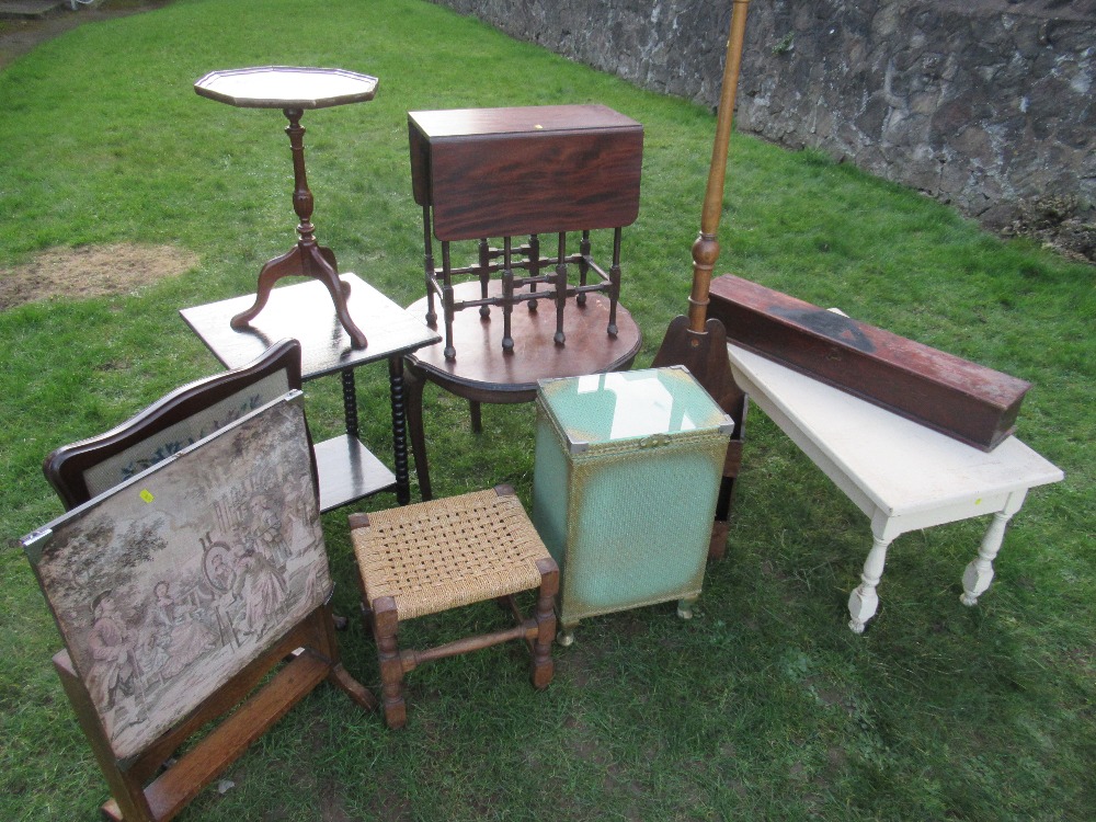 A collection of furniture including tables, cabinets etc